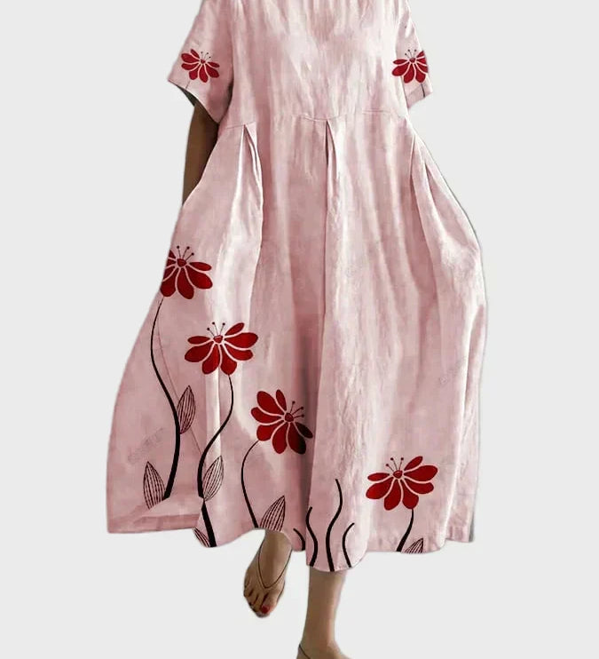 Rosa Kleid mit roten Blütenranken